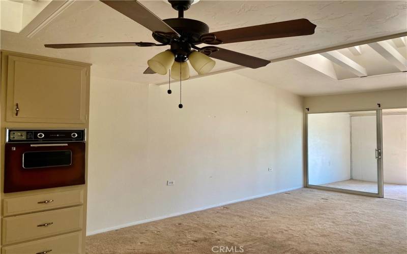 LOOKING TOWARDS THE LIVING ROOM.    CEILING FAN IN T HE KITCHEN