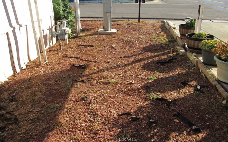 Side yard with plenty of room to have a garden