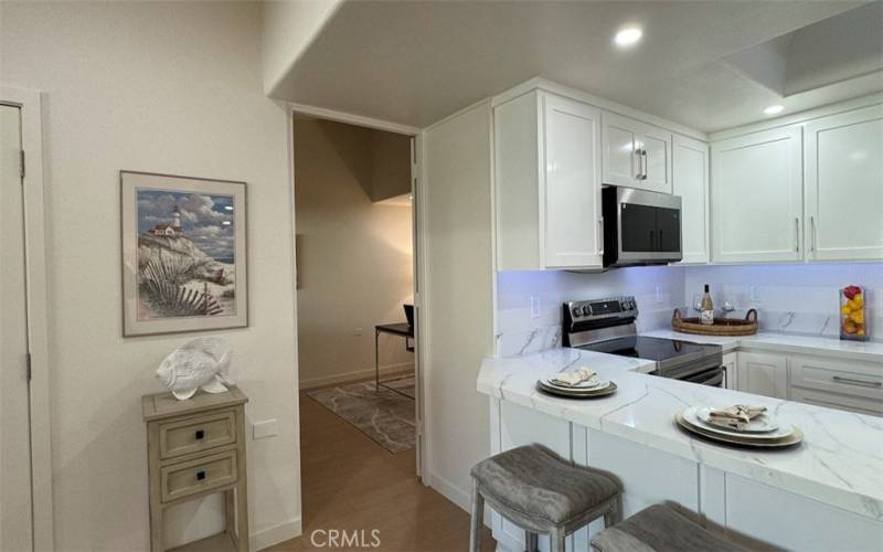 Kitchen looking toward second bedroom/den