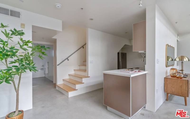 Stairs to loft next to kitchen