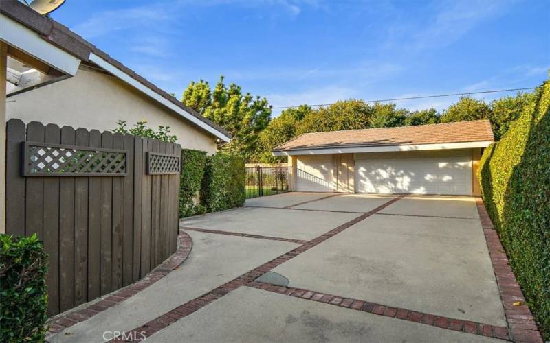 long driveway with 3 car garage