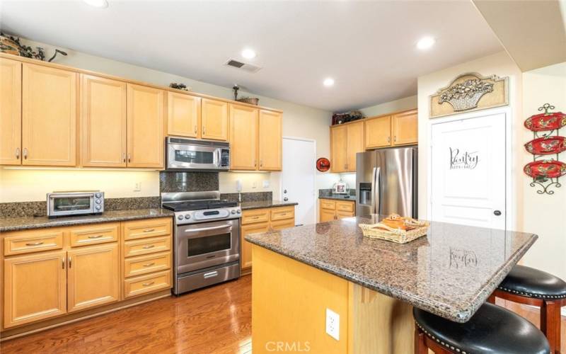 Huge entertainers and chefs kitchen, featuring granite countertops and upgraded stainless steel appliances