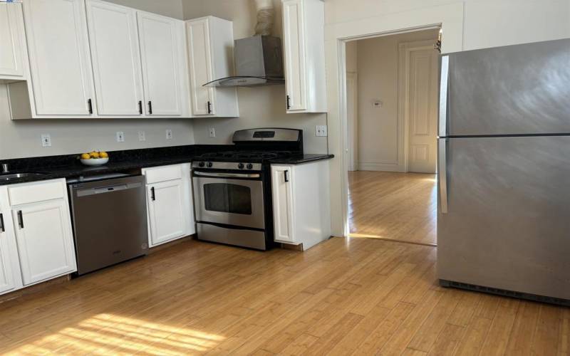 Kitchen features stainless appliances, granite countertops and new fixtures.