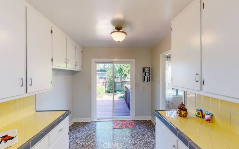 Breakfast nook or room for desk next to sliding door.