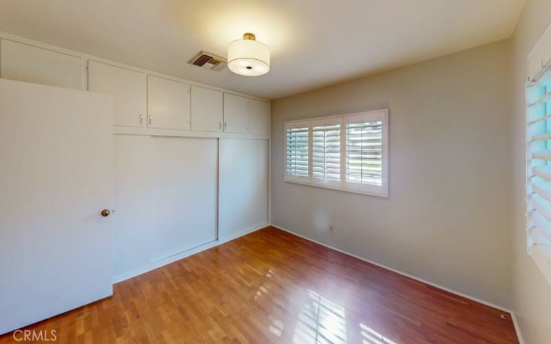 Front bedroom with wall of built in storage