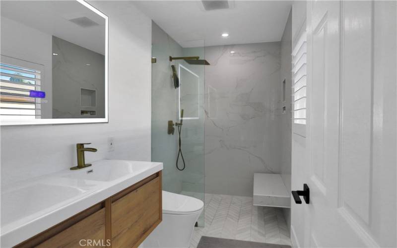 Beautiful walk-in shower and floating vanity