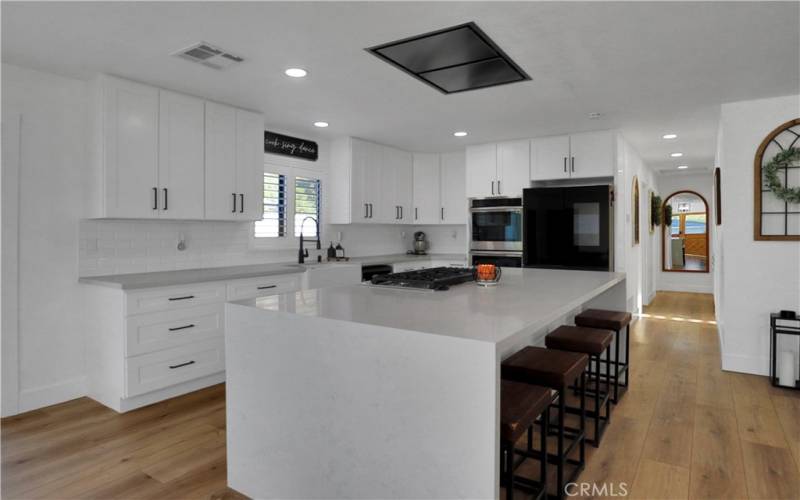 All newer kitchen with large, quartz counters