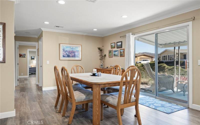 Dining area with access to the porch which overlooks the canal. Canal is seasonal. Well maintained. Fills

with rain and is a natural habitat for egret, ducks, etc.