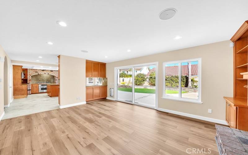 Family Room with fireplace opens to backyard.