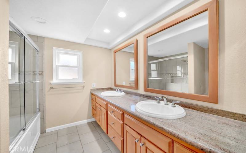 Upstairs bathroom with dual vanities.