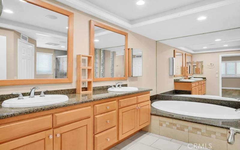 Primary bath suite with dual vanities.