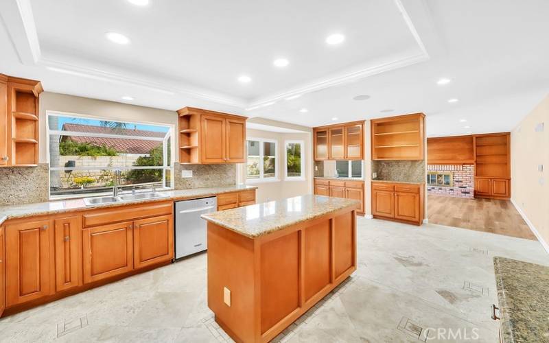 Remodeled kitchen with ample counter space, island and walk-in pantry.