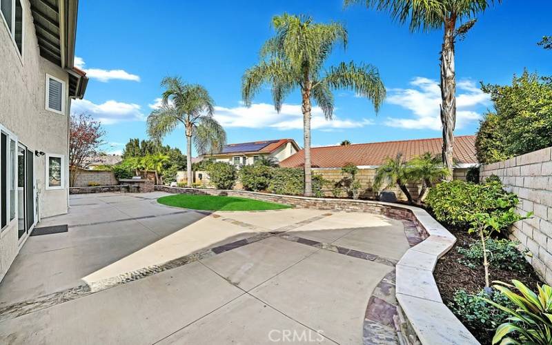 Expansive backyard experience provides time for entertaining and outdoor cooking over the custom BBQ.