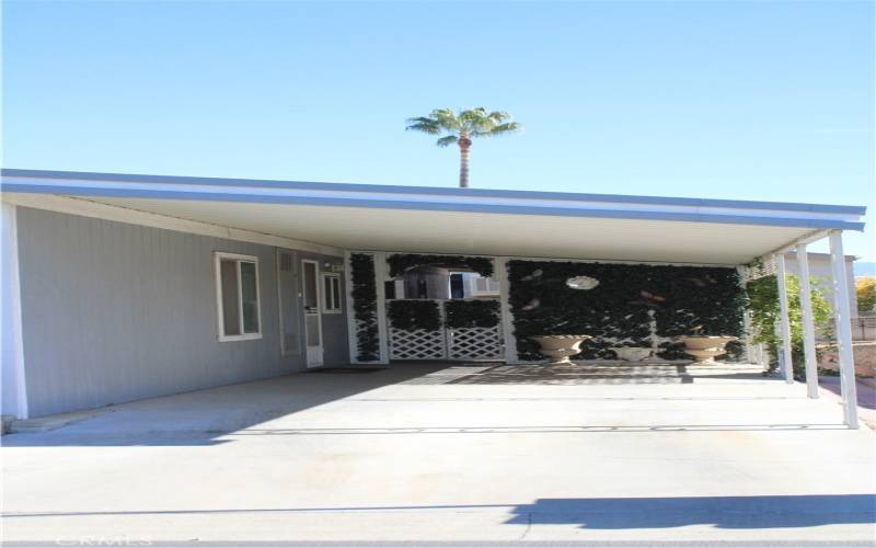 Main carport parking (fits two cars).