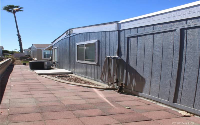 Brick-paved back area. Low maintenance.