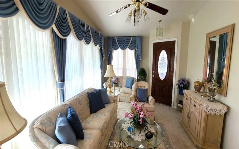 Formal Living Room with plenty of natural lighting and a beautiful view.