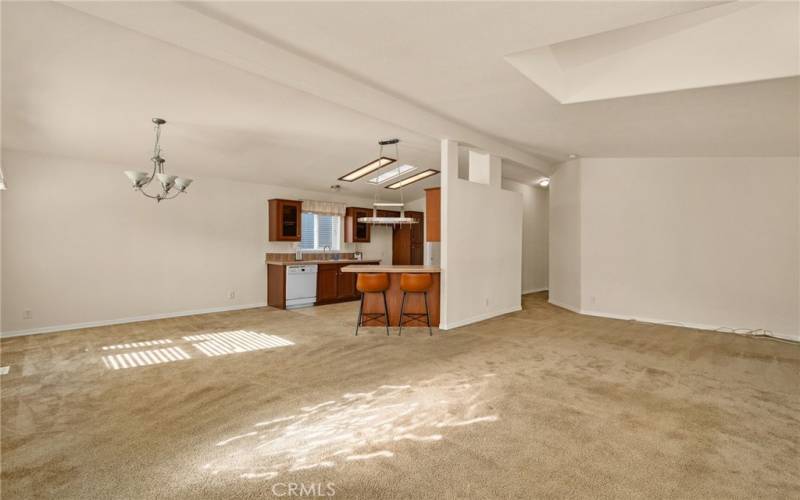 View of the dining room and kitchen from the living room.