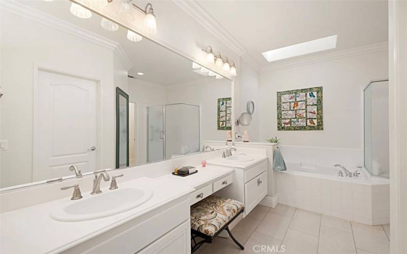 Dual sinks, skylight over oval tub