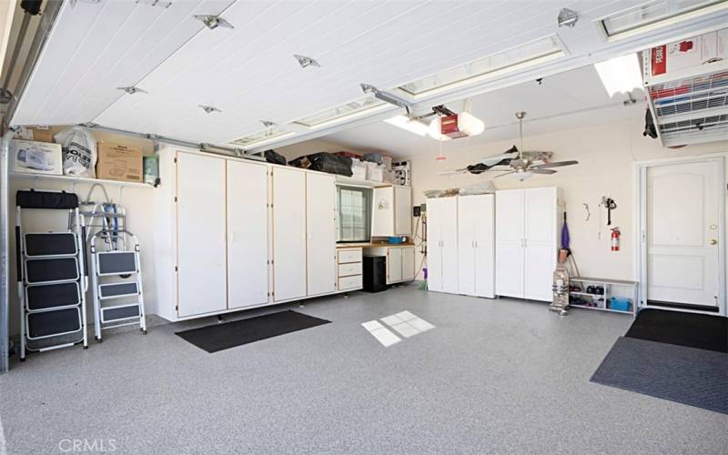 2.5 car garage, epoxy floors, built in cabinets