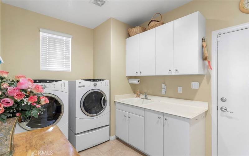 Inside Laundry Room leading to attached 2 car garage