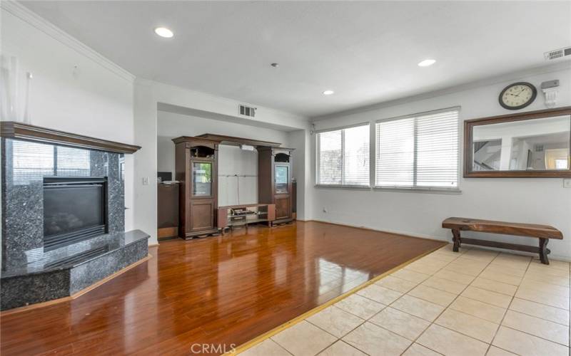 Family room with fireplace right off the kitchen