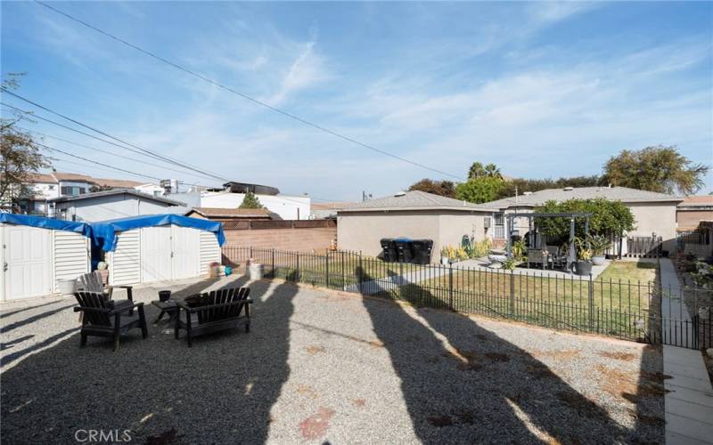 View of backyard from the back of the property looking at the garage.