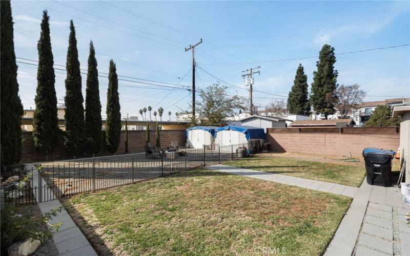 Spacious backyard offering endless possibilities.  Mature Cypress Trees for added privacy.