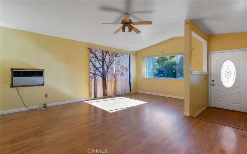 Spacious living room with oak flooring.