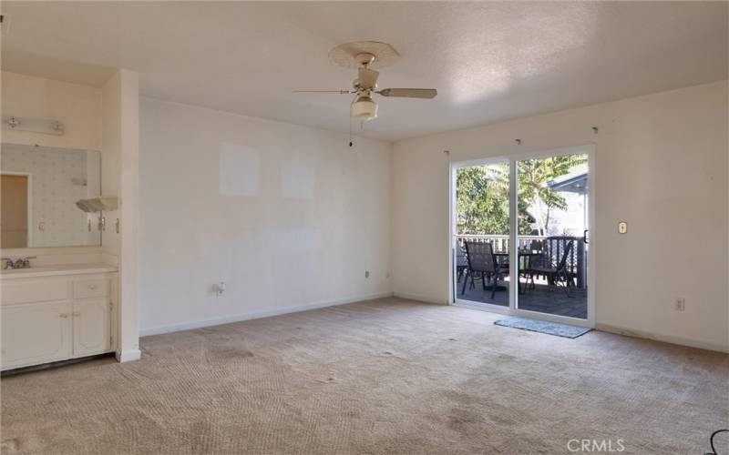 Primary bedroom with door to sitting area.