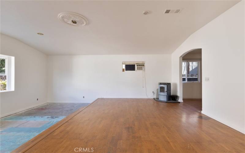 Large third bedroom with pellet stove and bay window.