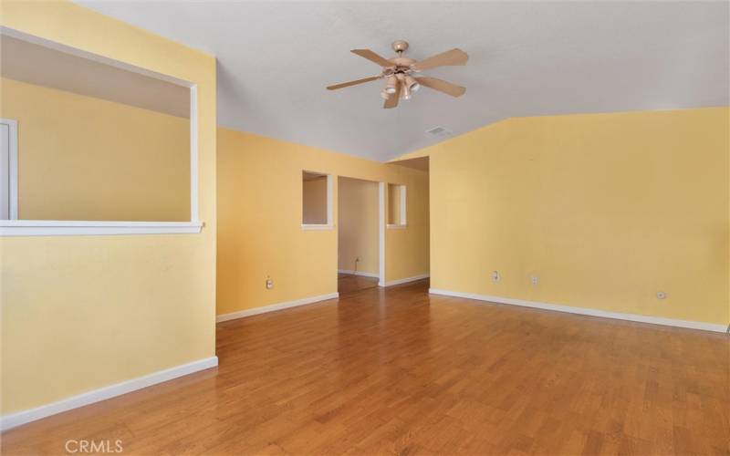 Living room adjacent to dining and kitchen. Great floor plan.