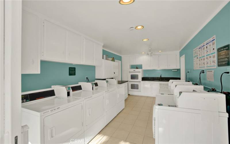 Community laundry facilities including cooking facilities and sink.