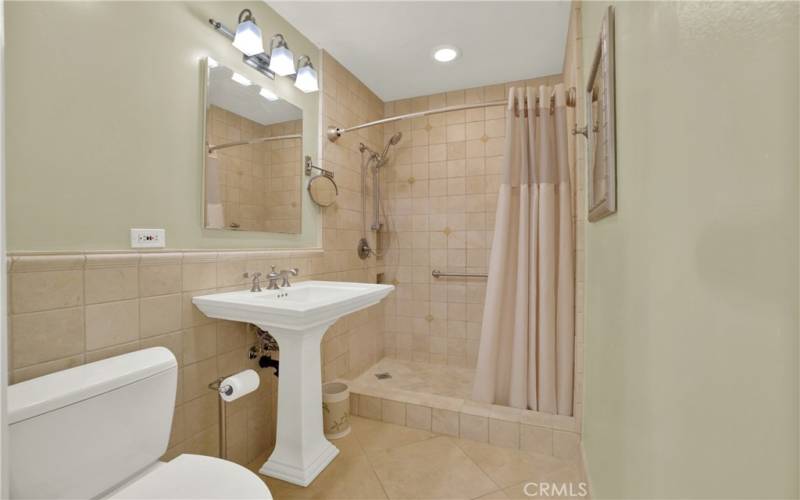 Full bath with walk-in shower & grab bars.