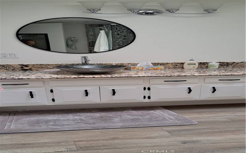 bathroom with granite counter