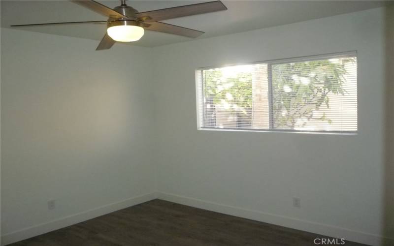 First of the two bedrooms with ceiling fan.