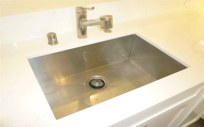 Large, single compartment stainless sink.