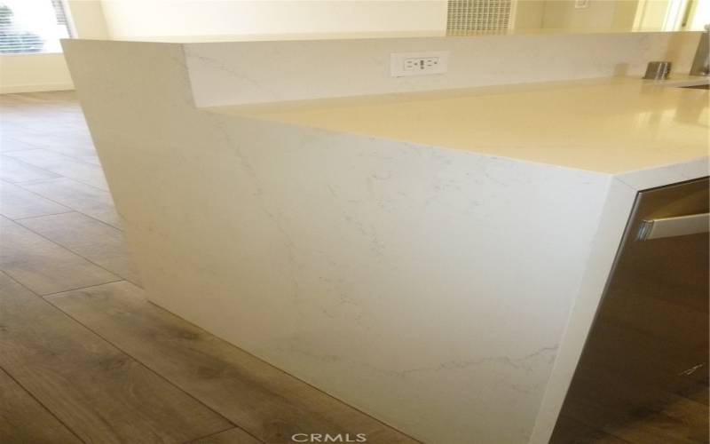 Quartz counter tops with a nice waterfall effect for an upgraded finish.