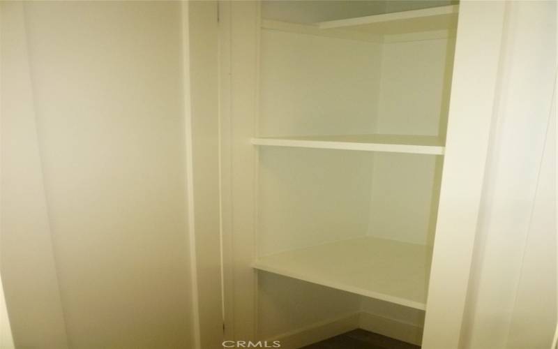 One of two hallway closets for additional storage capacity.