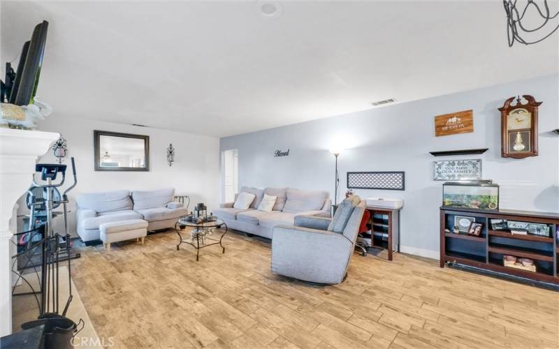 Open living room with fireplace.