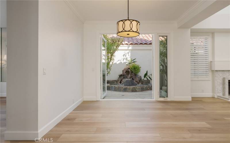 formal dining room open to patio and water feature