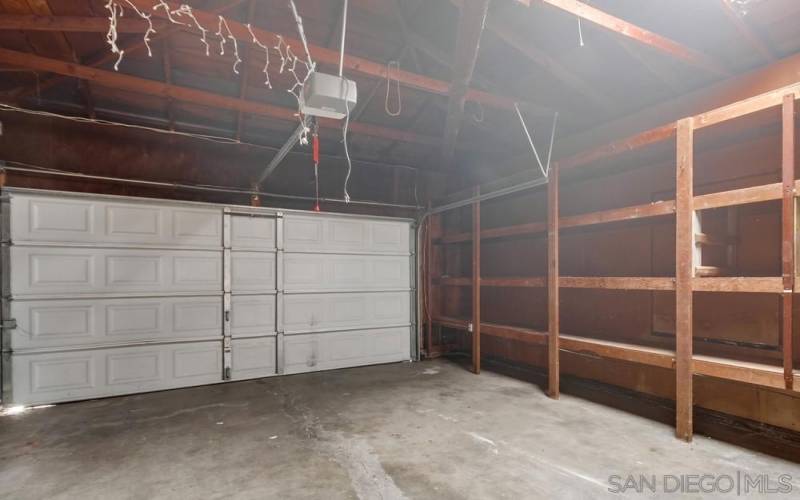 Garage with shelving in front unit