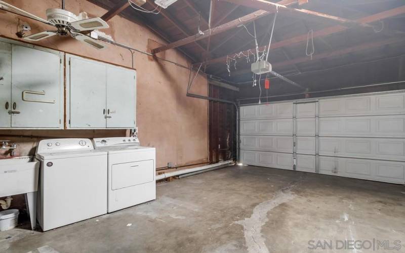 Garage with washer and dryer in front unit