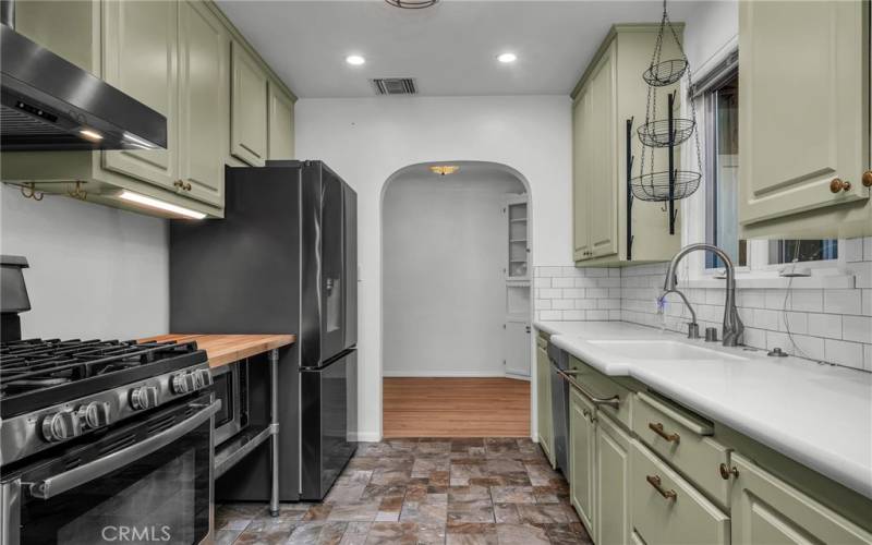 Quartz countertops and subway backsplash in kitchen