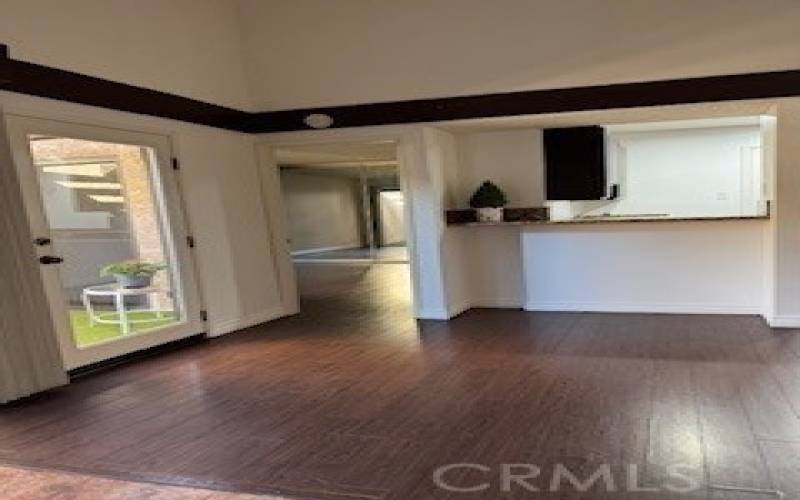 View to kitchen and bedroom from living room.