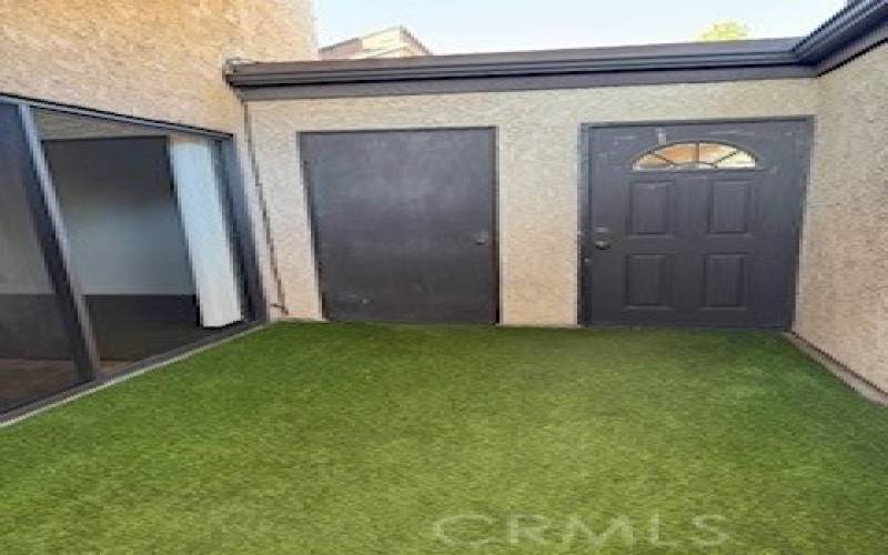 Patio facing the front door.