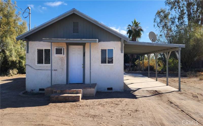 Front view of house and carport