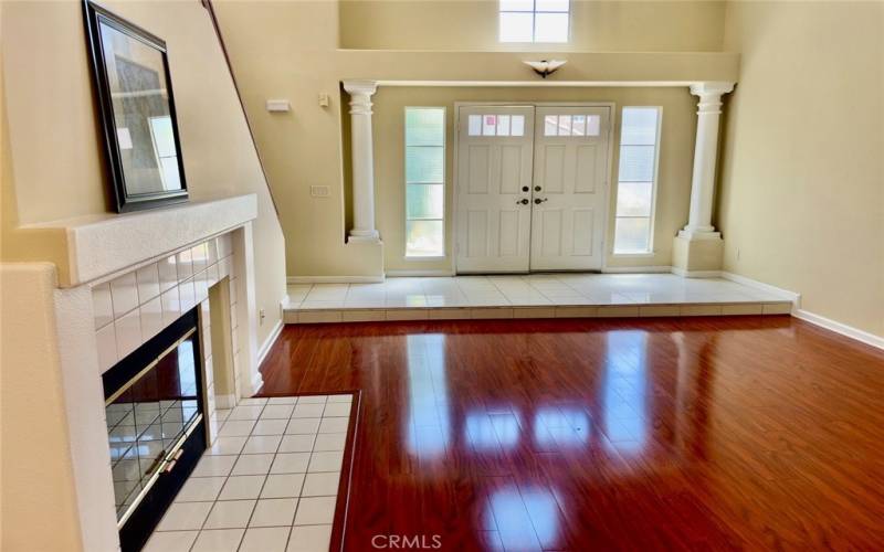 Formal living room with wood flooring and fireplace