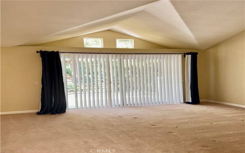 Primary bedroom with slider out to private patio