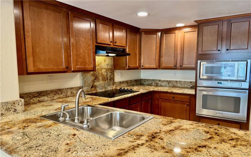 Remodeled kitchen with granite counters