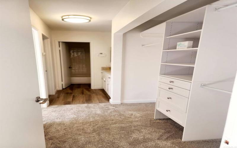 Large hallway closet with organizational storage